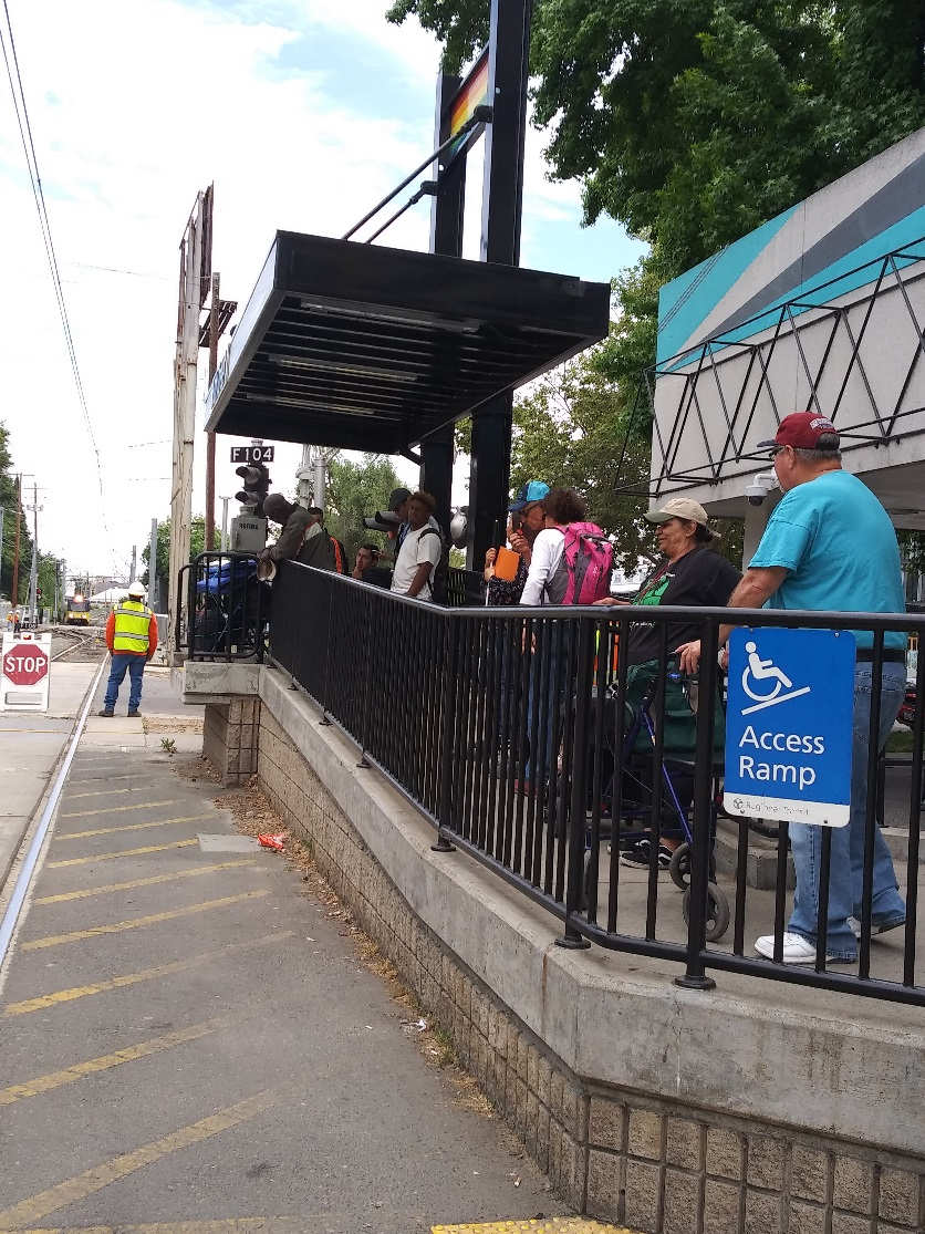 volunteers lined up at the light rail station