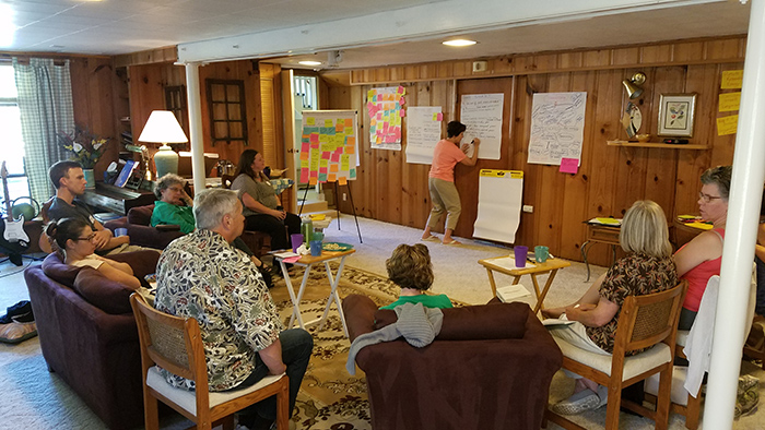 a group of volunteers brainstorming at a retreat