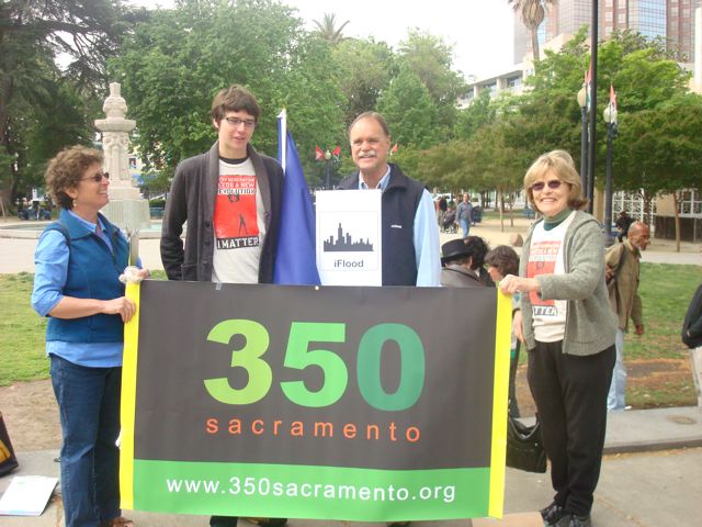 Volunteers at the capitol holding a 350 Sacramento banner