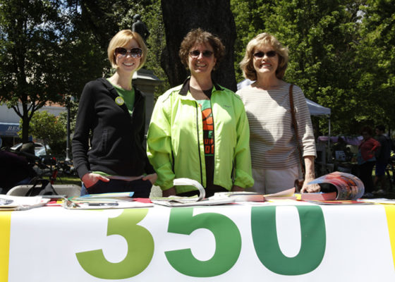 three volunteers tabling at an event