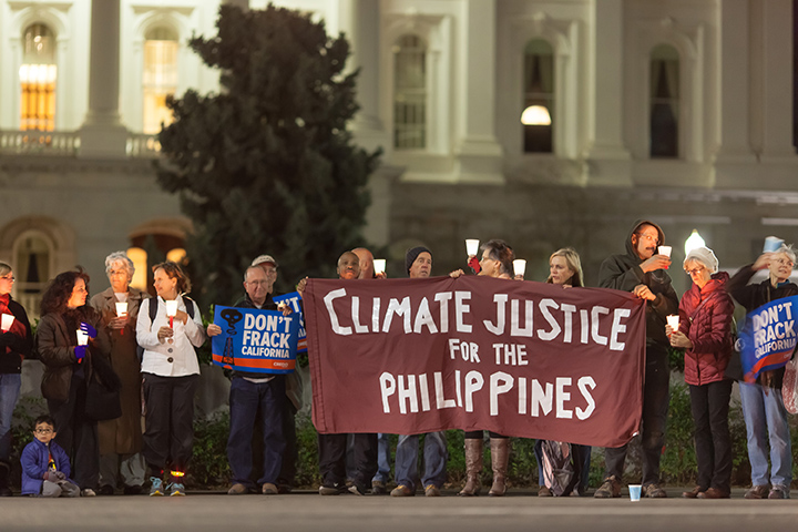 volunteers holding climate justice for the philippines banner